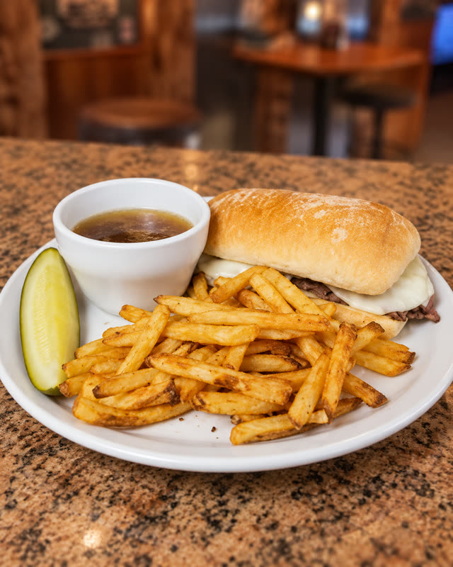 Roadhouse burger with fries and au jus