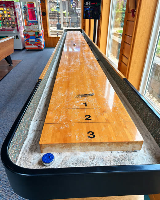 Shuffleboard table in the arcade room