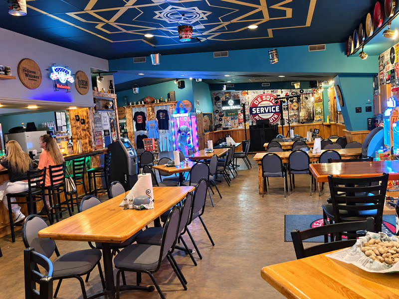 The dining room with the arcade glowing in the back