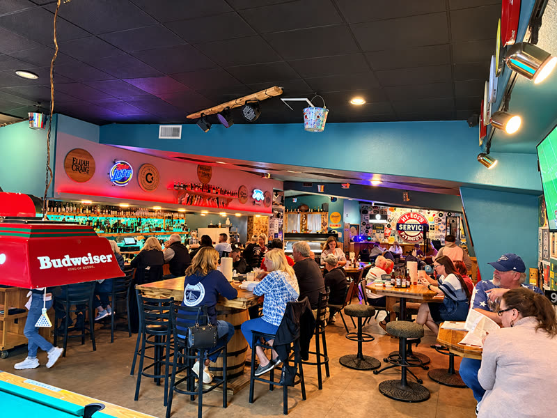 A packed house around the bar and pool table