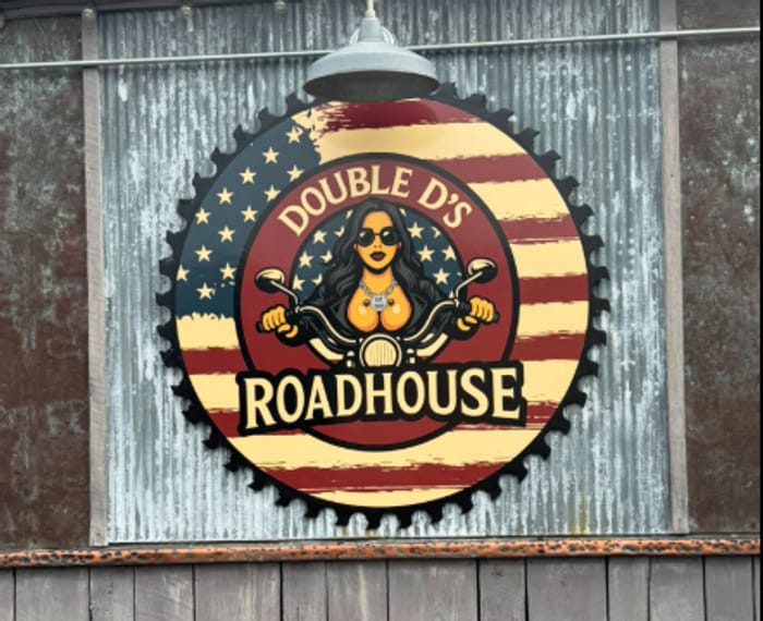 The Double D's Roadhouse sign on the front of the building